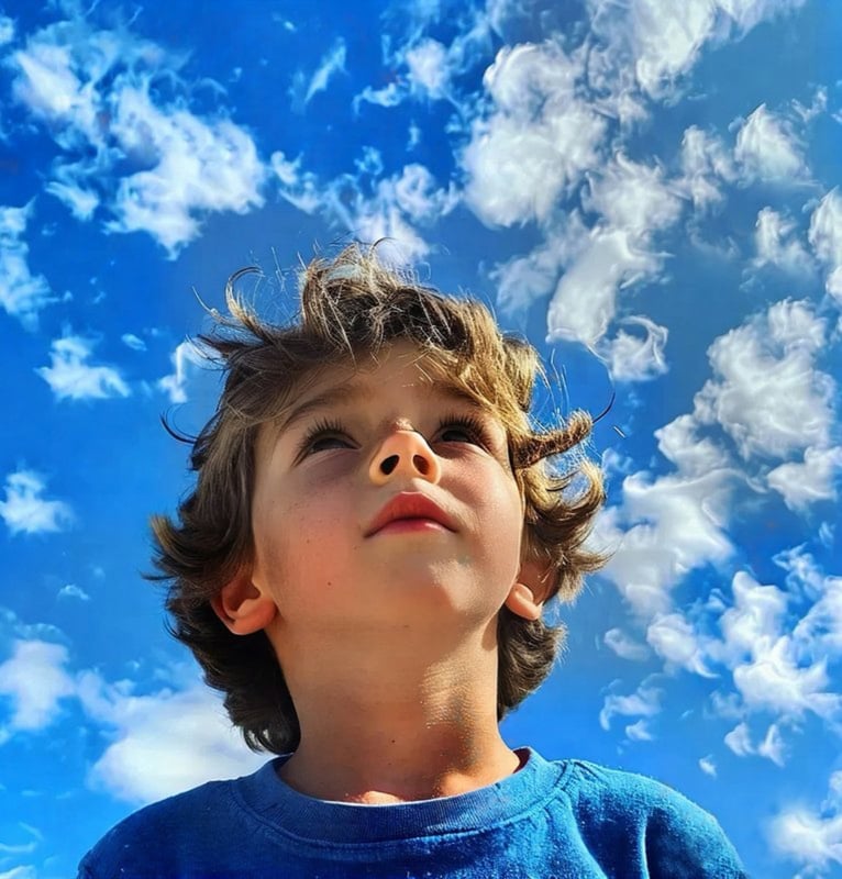 A child looking up at an open sky